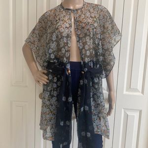 Adorable Womens Floral Sheer Cover Cardigan. Daisies. Button on neckline. Open